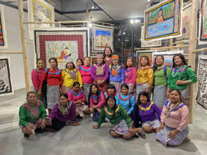 Group portrait of the Shinan Imabo collective with curator Miguel A. López, Lima, 2023.